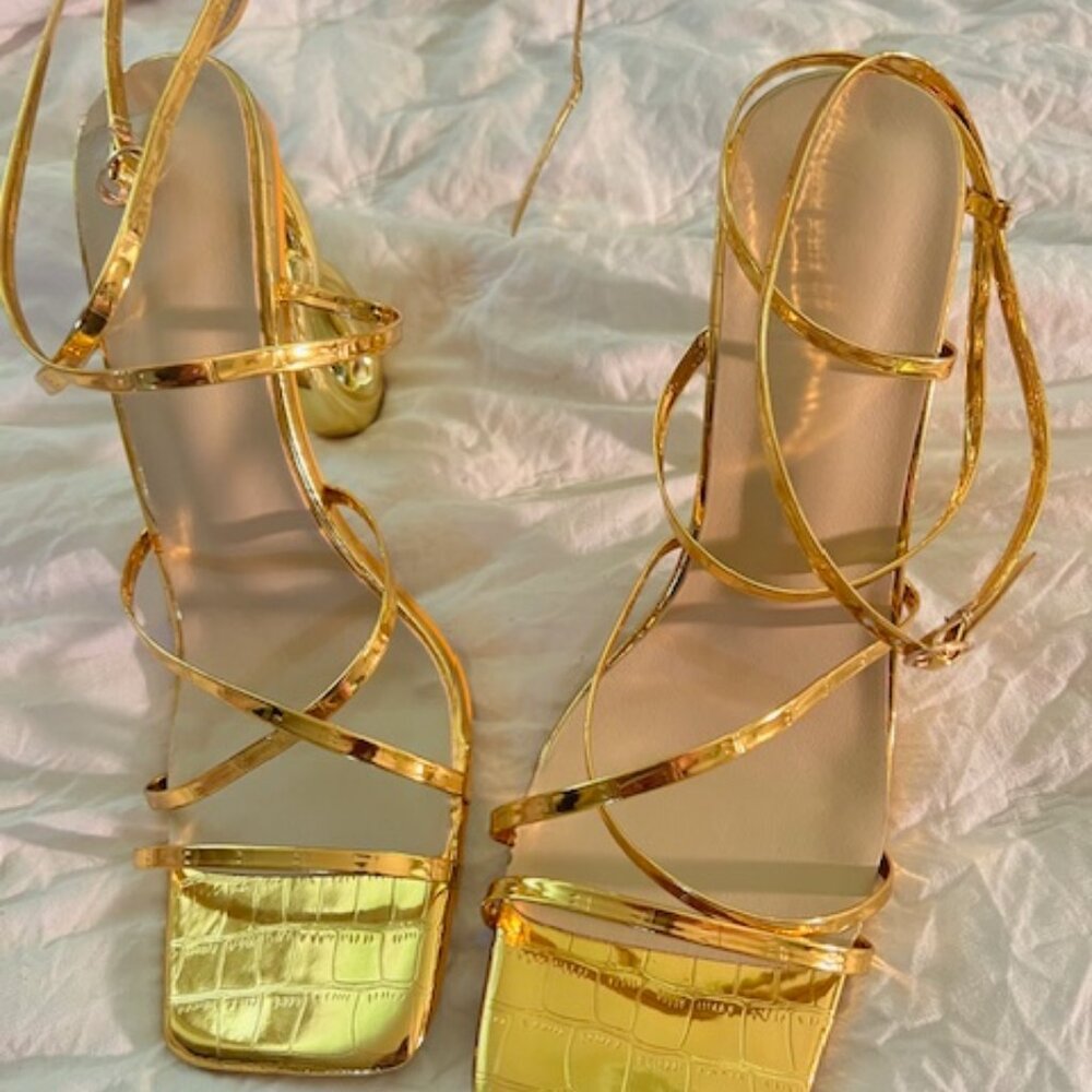 Womens gold sexy strappy sandals with a very unique heel